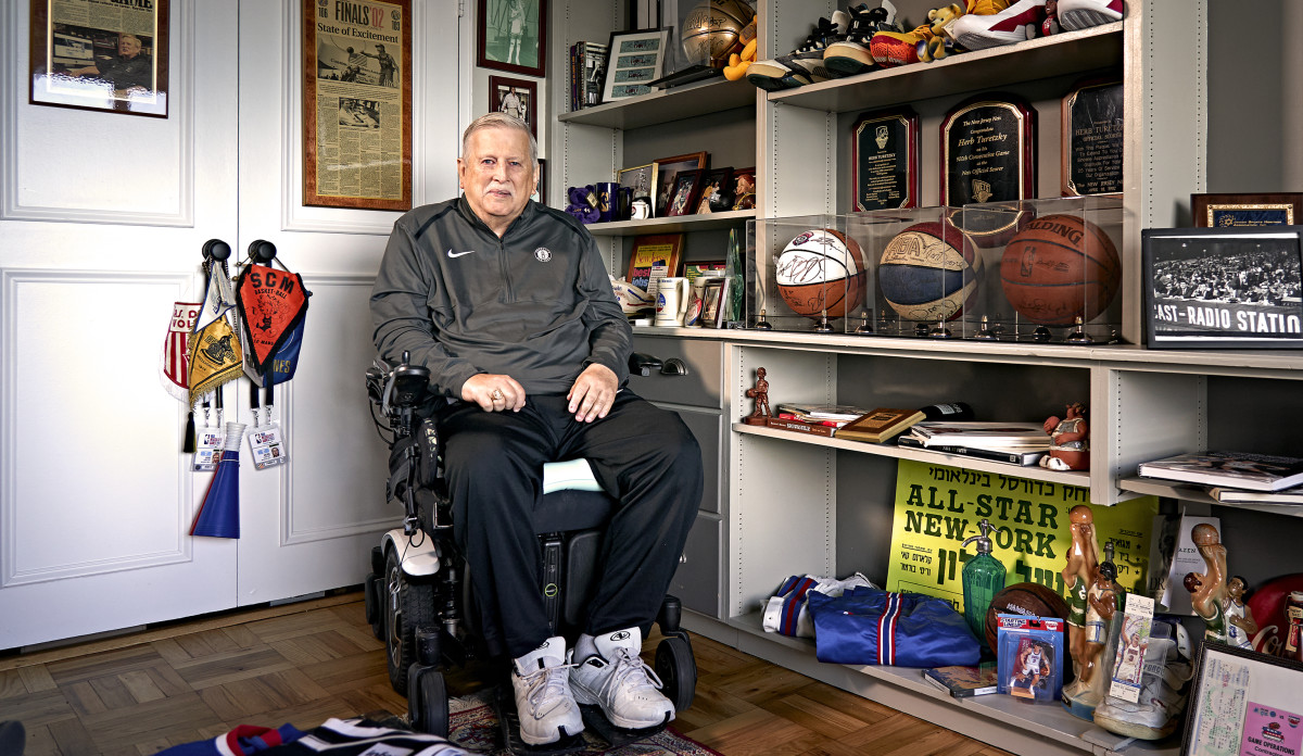 TEAM PLAYER Turetzky, who has been on the job courtside for 54 years, keeps a shrine to the Nets in his apartment.
